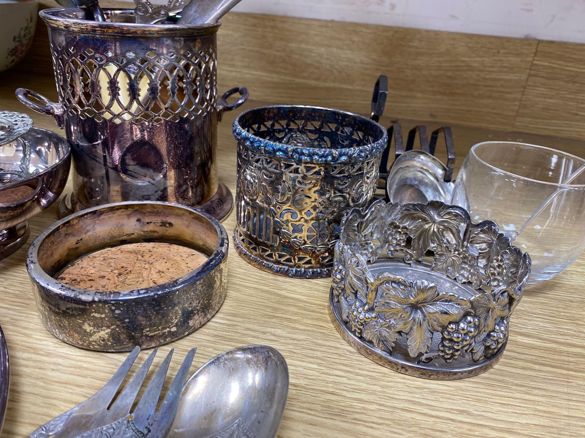 A quantity of plated items including coasters, flatware, cream jug, etc.